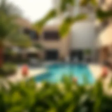 Relaxing Outdoor Pool Area Outdoor pool area surrounded by lush greenery and modern amenities